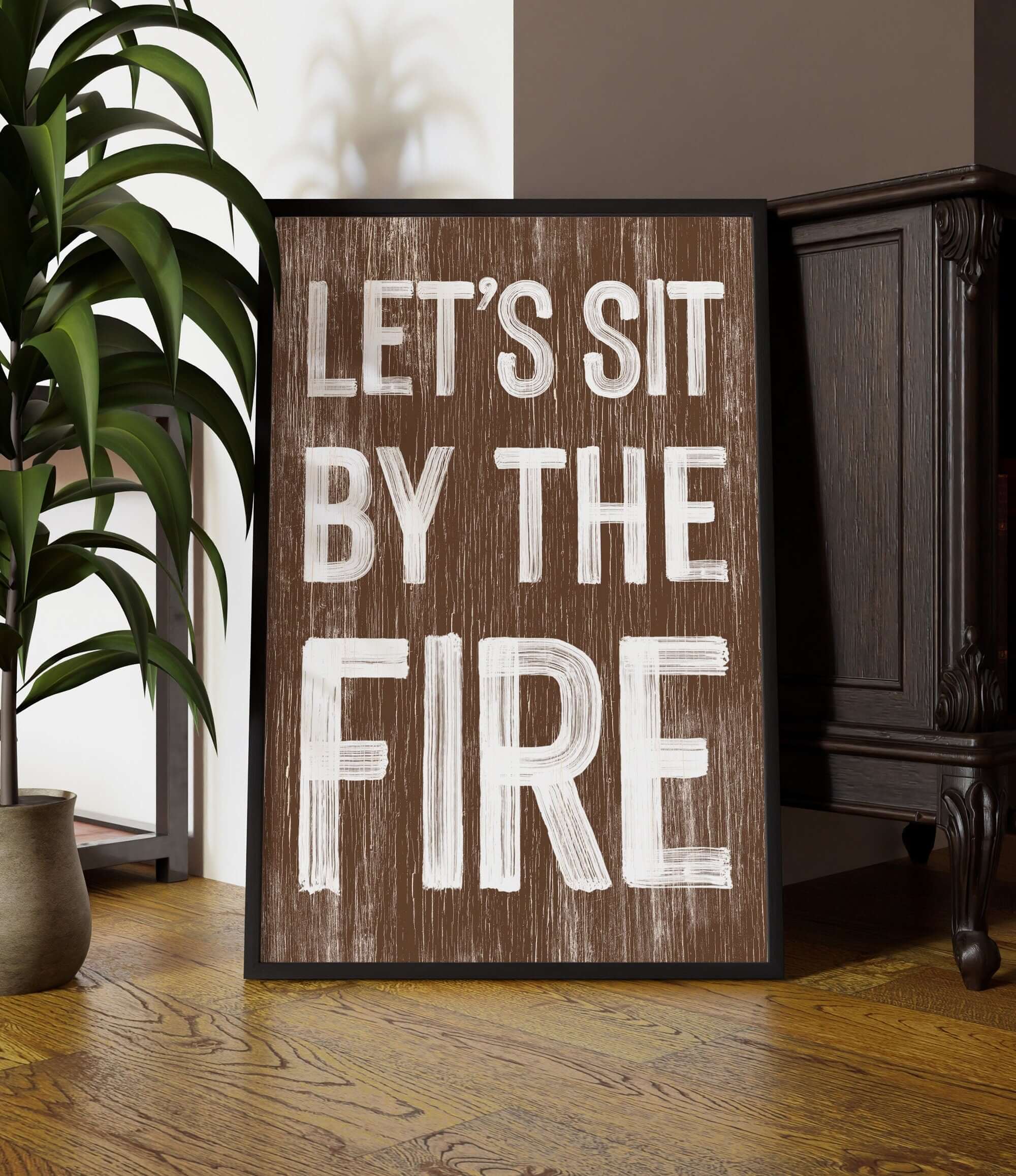 a wooden sign that says, let's sit by the fire