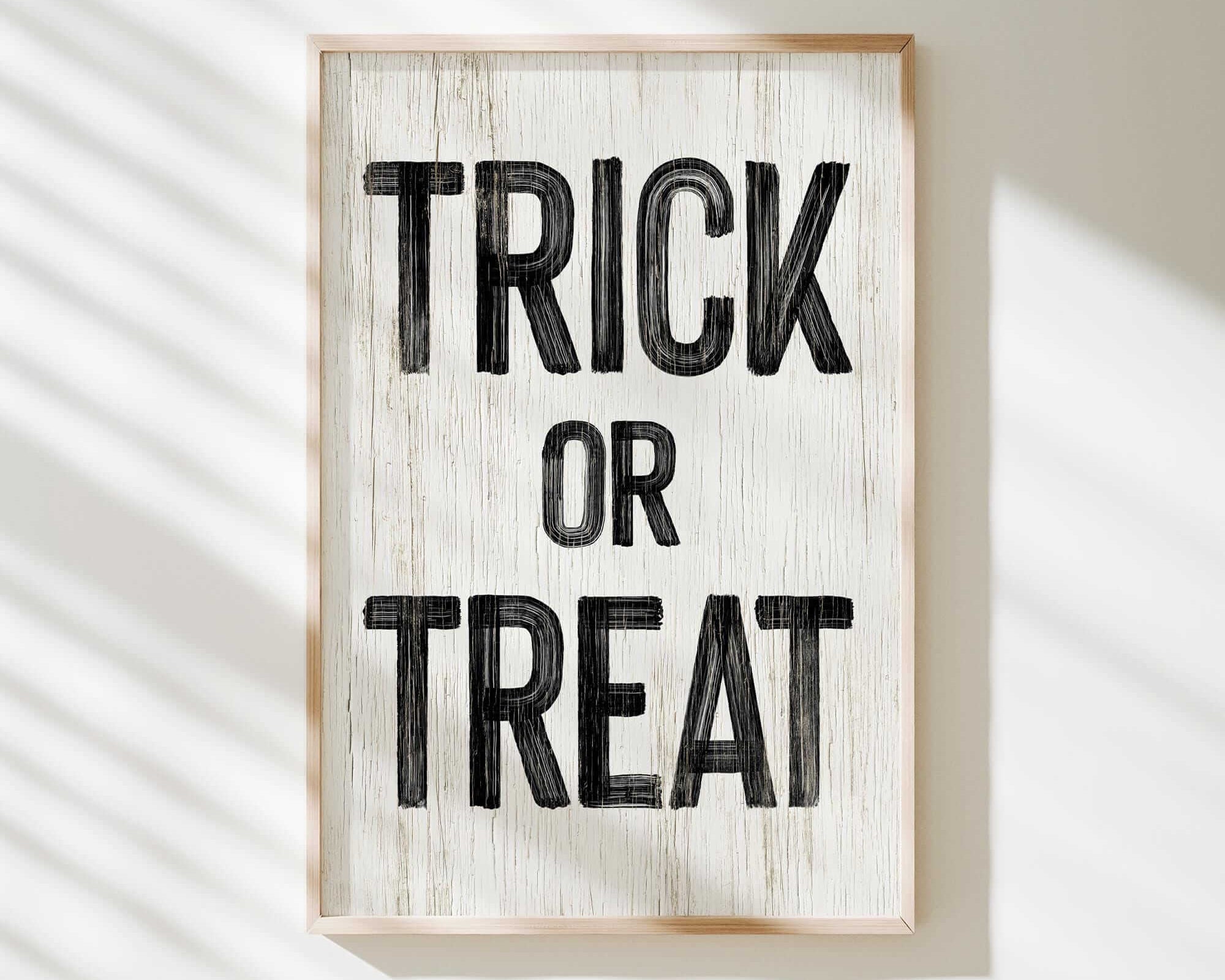 a sign that says trick or treat hanging on a wall