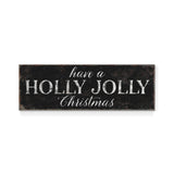 a sign that says have a holly jolly christmas