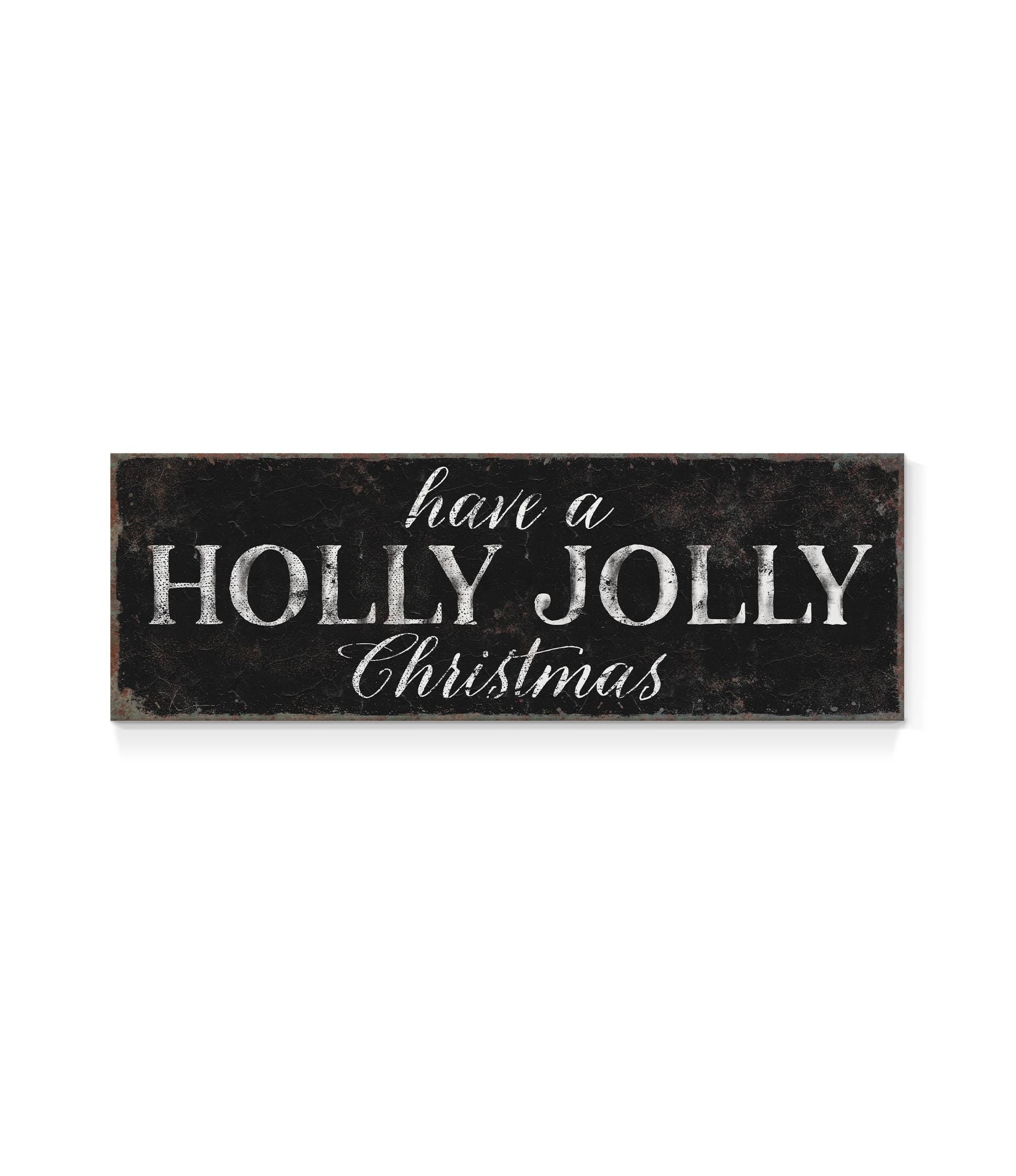 a sign that says have a holly jolly christmas