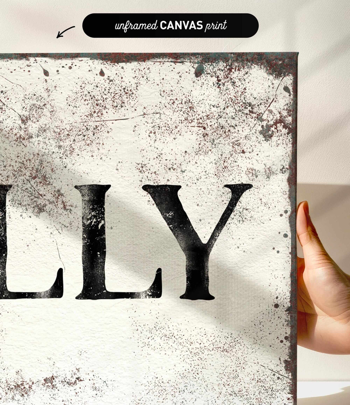 a person holding up a sign that says lily