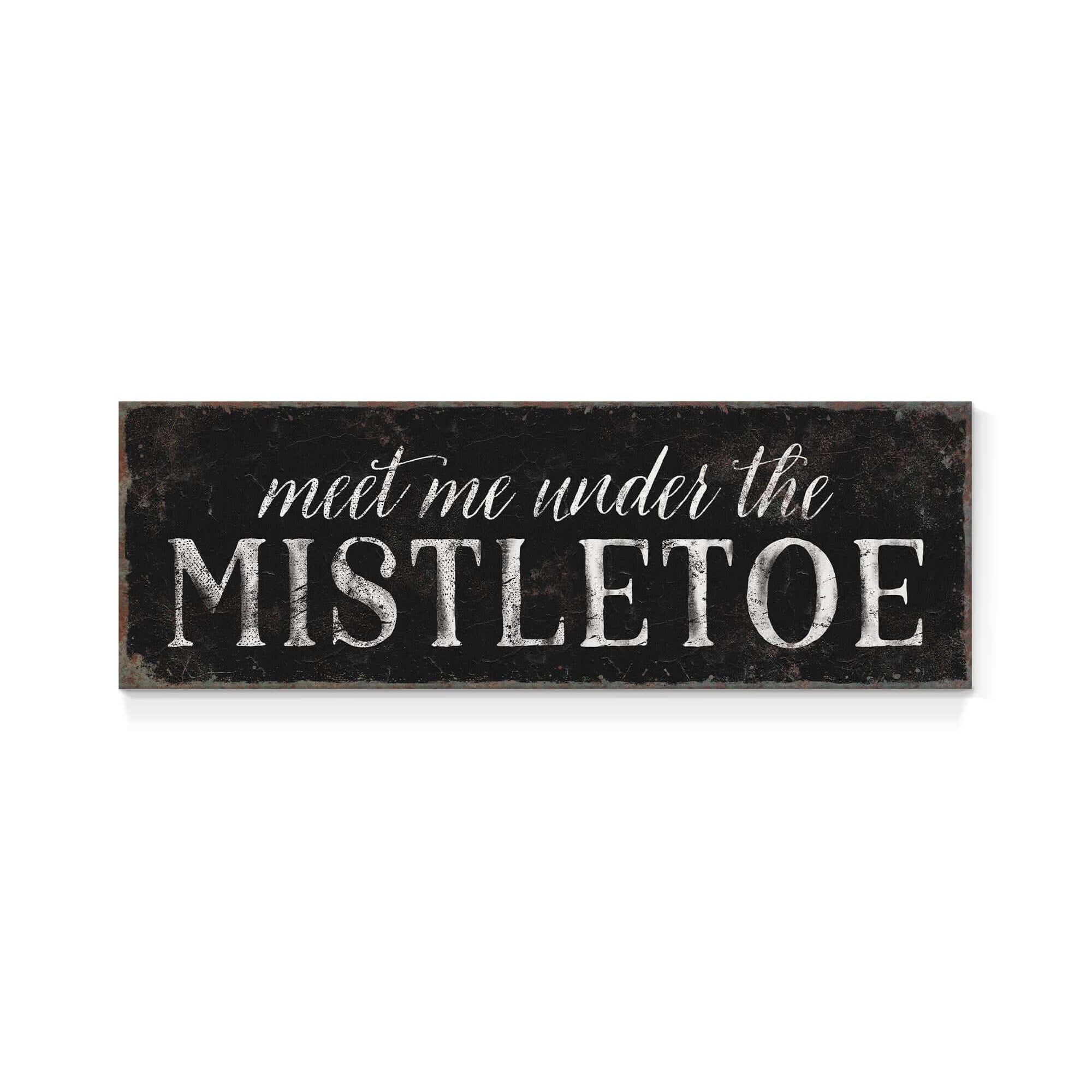 a sign that says meet me under the mistletoe