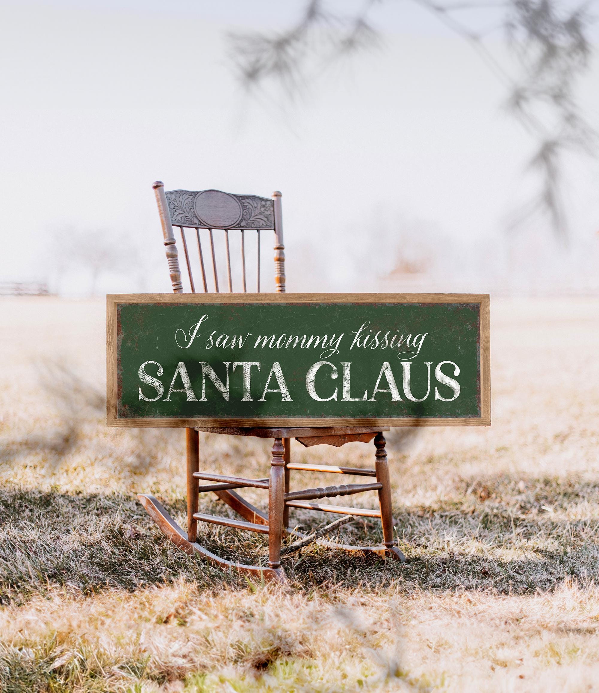 a wooden rocking chair sitting in a field