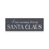 a sign that says i saw mommy kissing santa claus