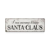 a sign that says i saw mommy kissing santa claus