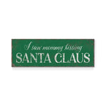 a green sign that says i saw mommy kissing santa claus