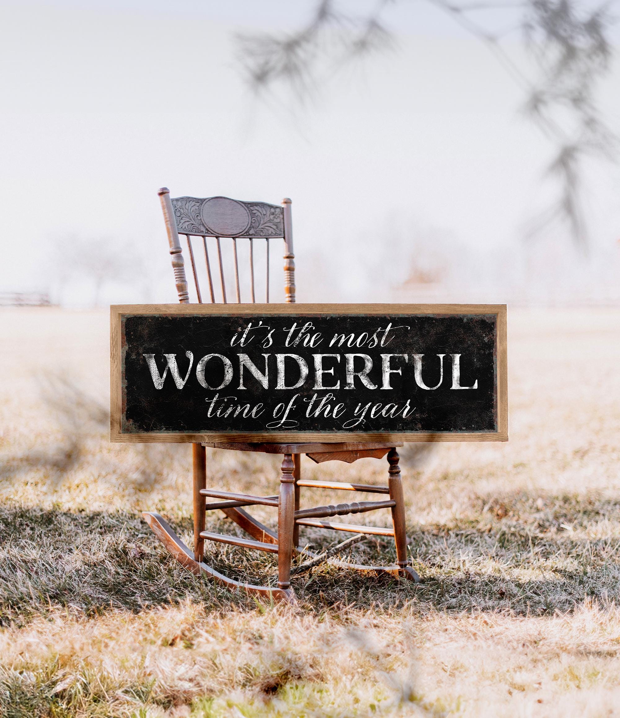 a wooden rocking chair with a sign that says it&#39;s the most wonderful time