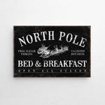 a sign on a wall that says north pole bed and breakfast