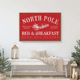 a bed and breakfast sign in a white room