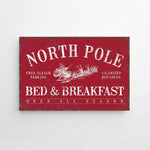 a red sign that says north pole bed and breakfast