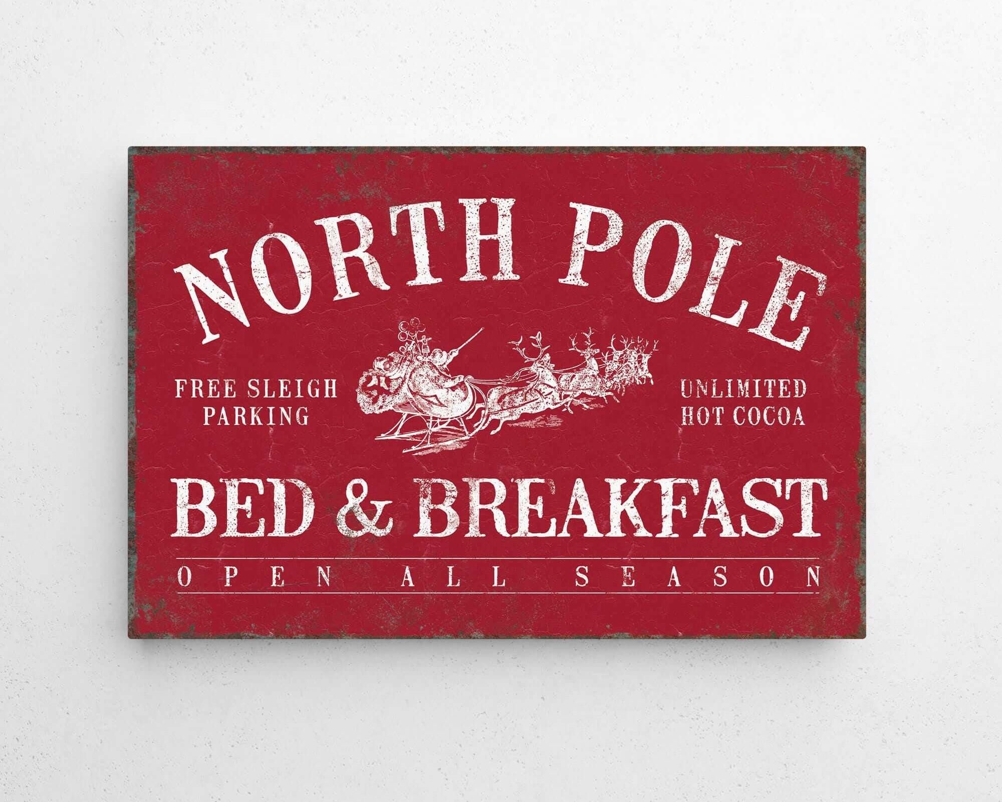 a red sign that says north pole bed and breakfast