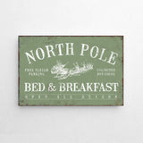 a sign on a wall that says north pole bed and breakfast