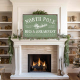 a fireplace with a sign that says north pole bed and breakfast