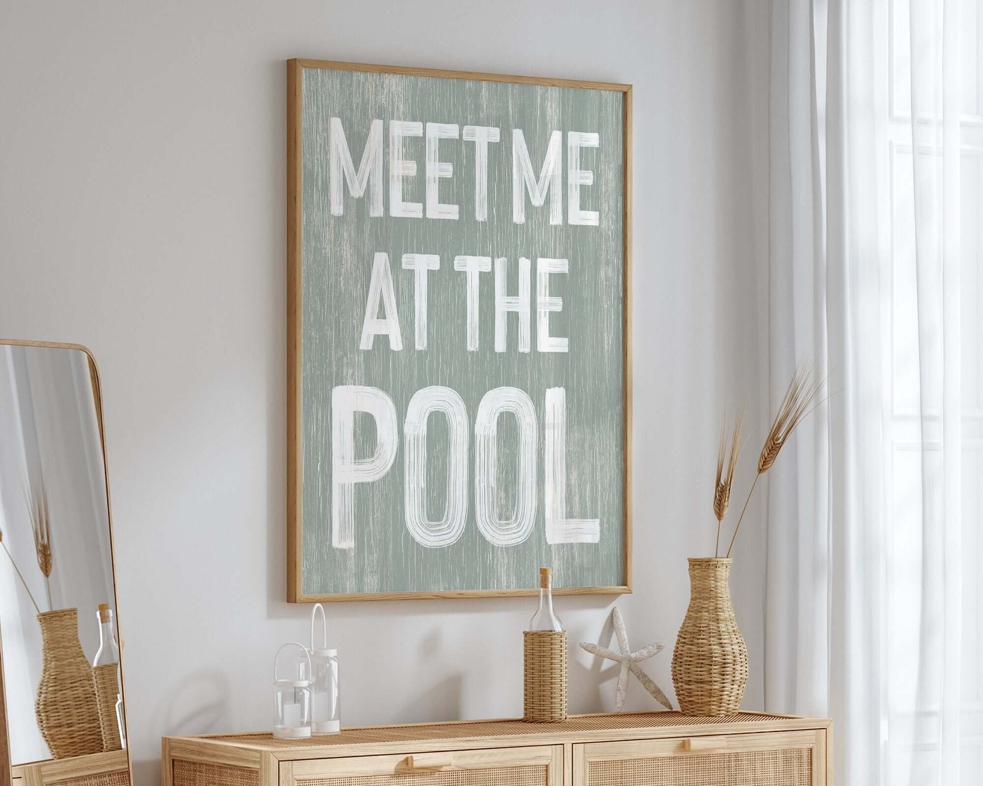 The Meet Me at the Pool Sign, Sage adds charm to a bright, airy room—perfect summer home decor with its retro style and inviting message.