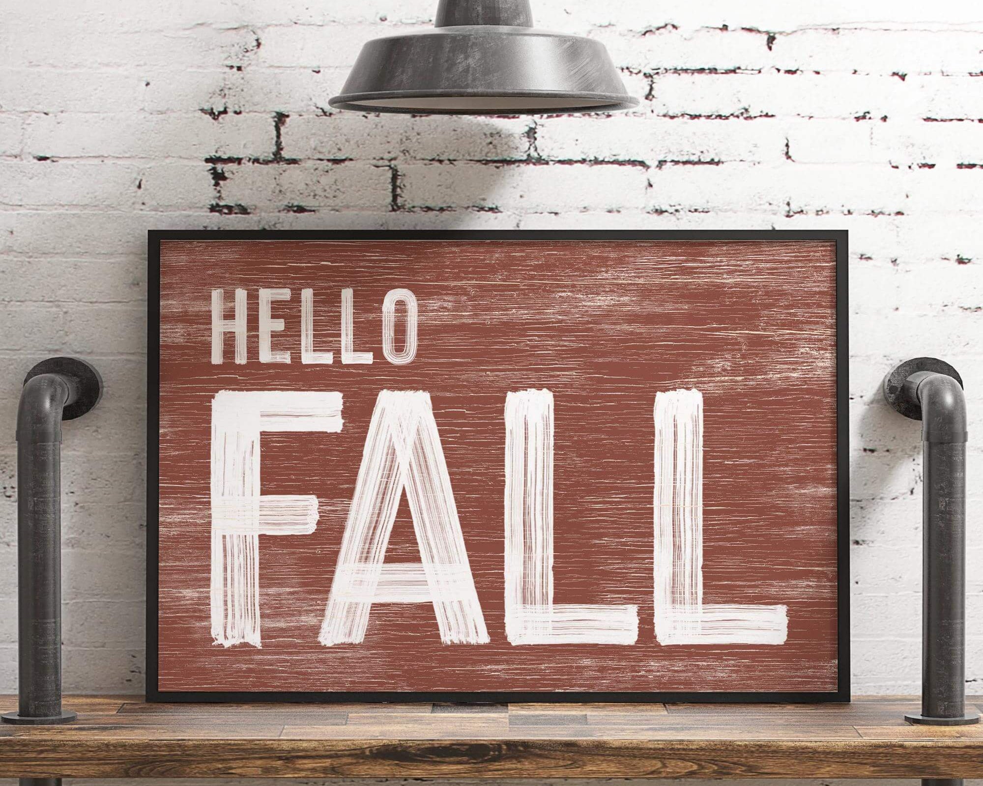 a wooden sign that says hello fall on it