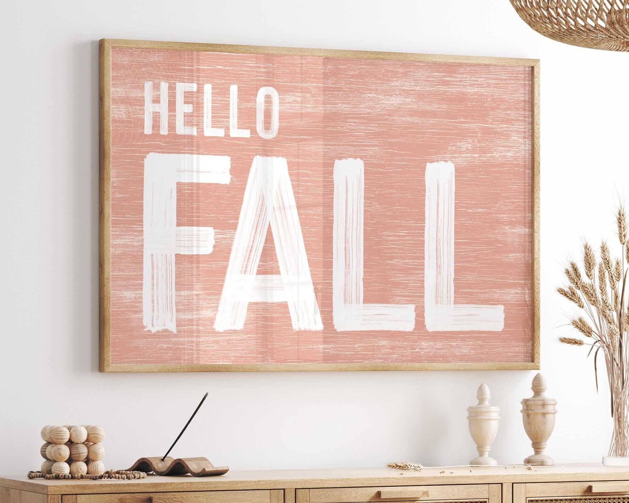 a picture of a hello fall sign hanging on a wall