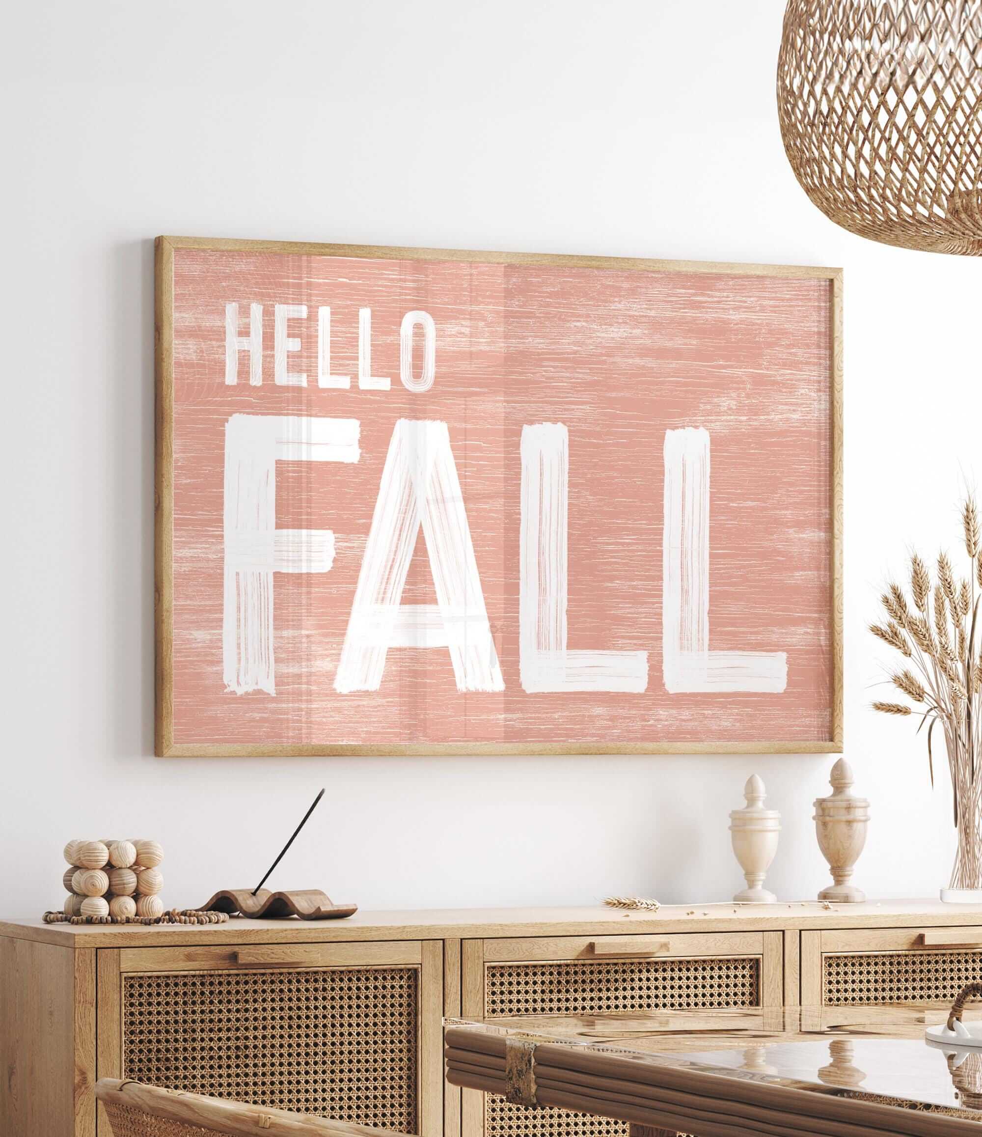 a picture of a hello fall sign hanging on a wall