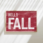 a red sign that says hello fall on it