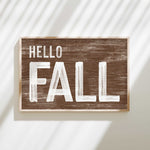 a wooden sign that says hello fall