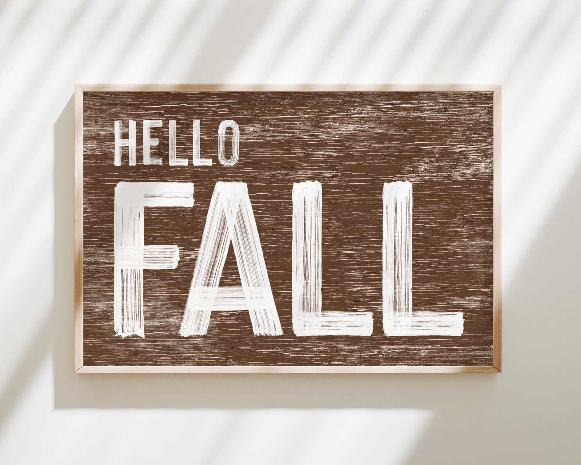 a wooden sign that says hello fall