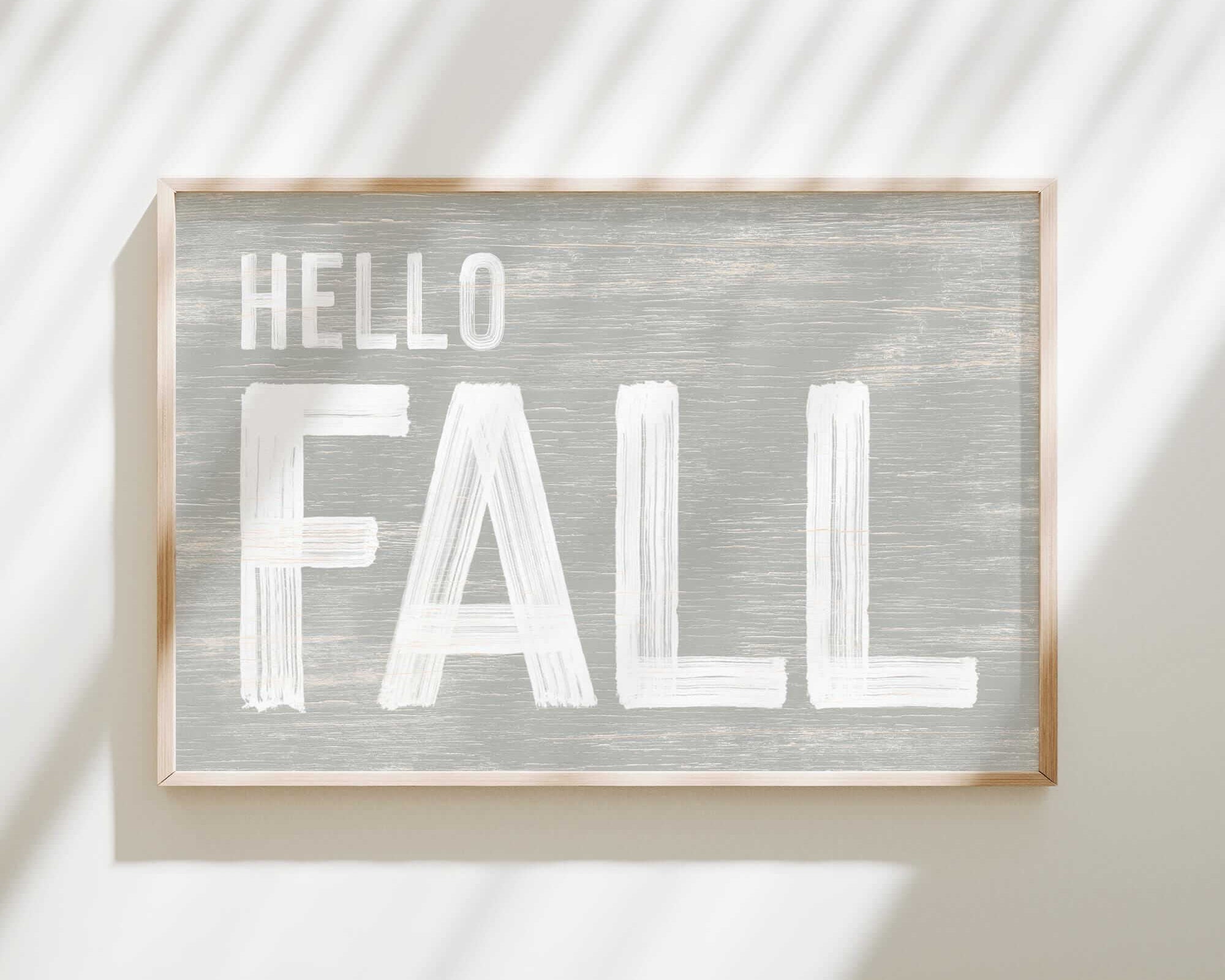 a sign that says hello fall hanging on a wall