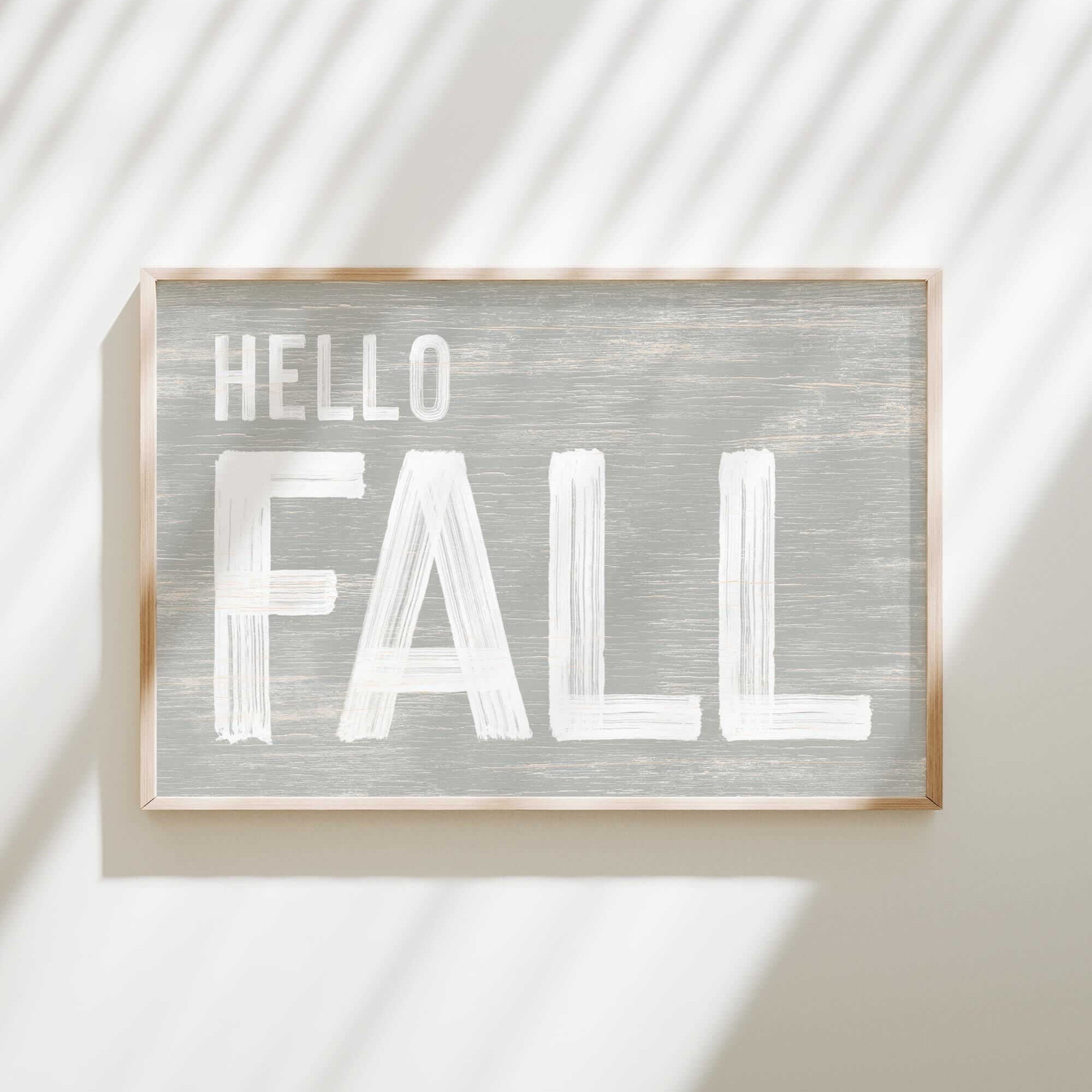 a sign that says hello fall hanging on a wall