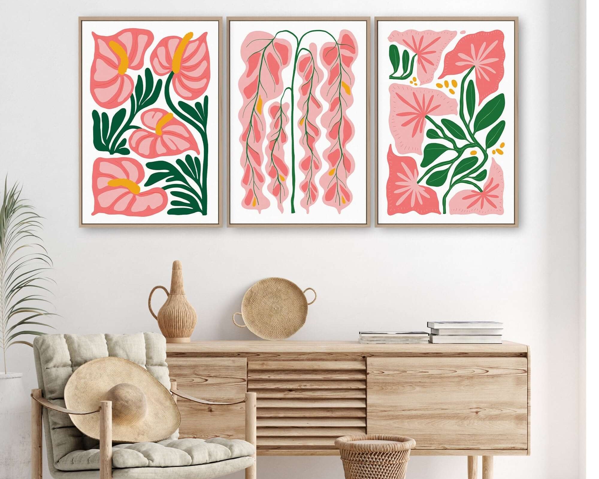 The "Tropical Blocks Triptych | Set of Three Prints | 409" hangs above a wooden sideboard with decor, adding abstract floral style to a bright, modern room.