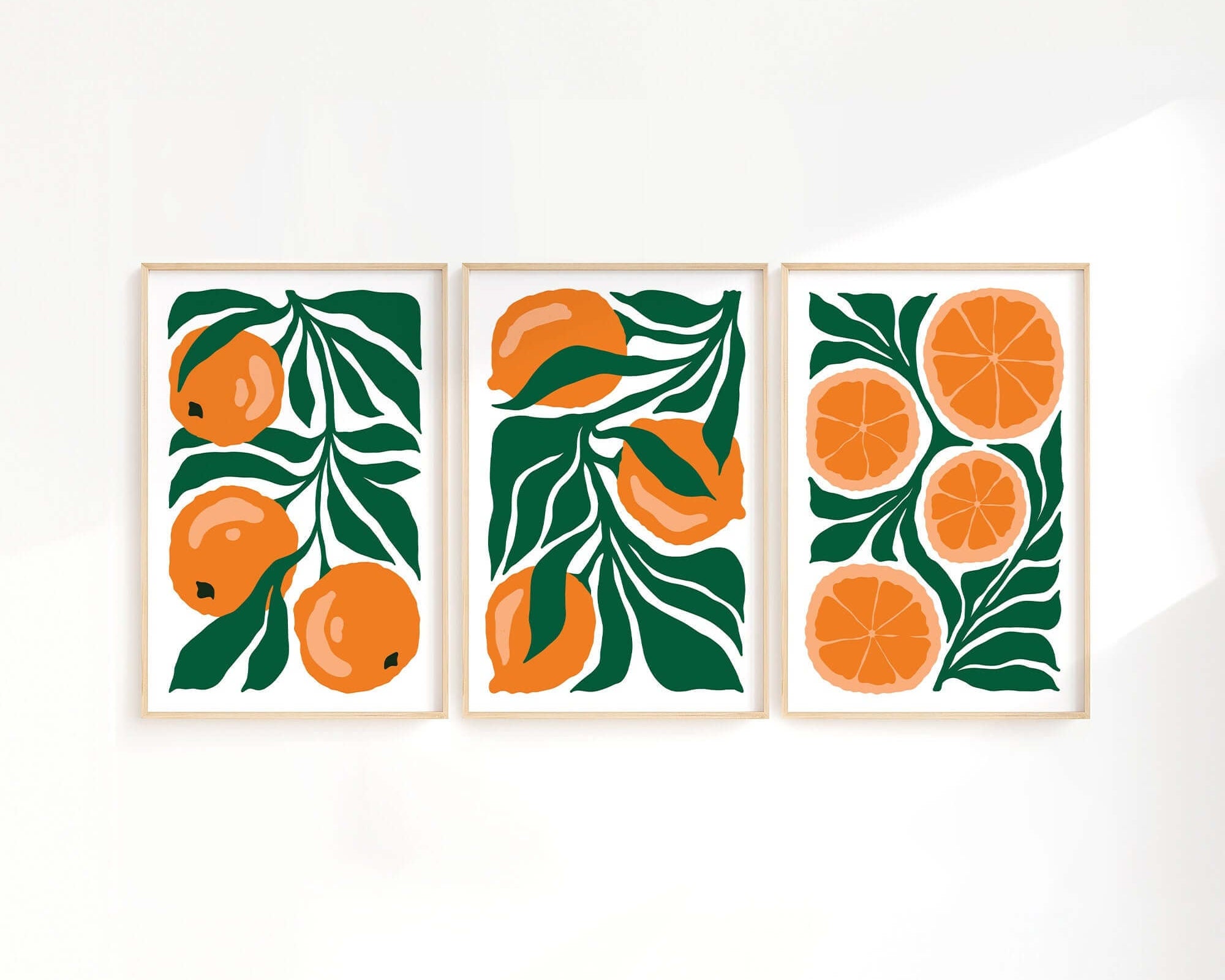 The Tropical Blocks Triptych | Set of Three Prints | 424 features three vibrant framed prints, ideal for refreshing your home decor with illustrated oranges and green leaves as a lively wall art collection.