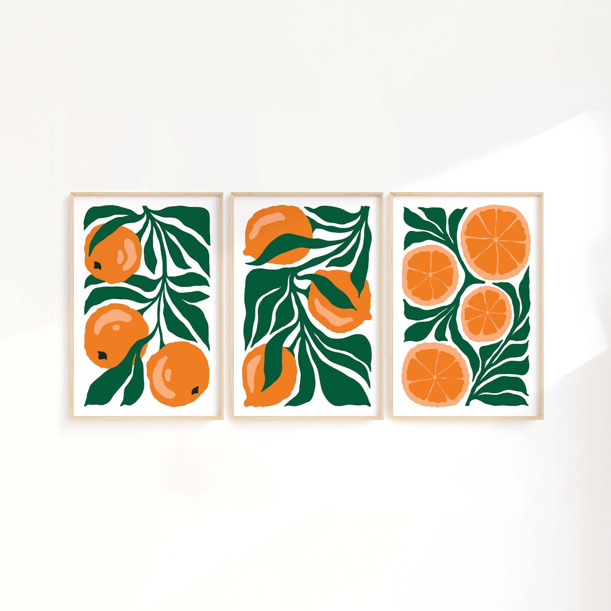 The Tropical Blocks Triptych | Set of Three Prints | 424 features three vibrant framed prints, ideal for refreshing your home decor with illustrated oranges and green leaves as a lively wall art collection.