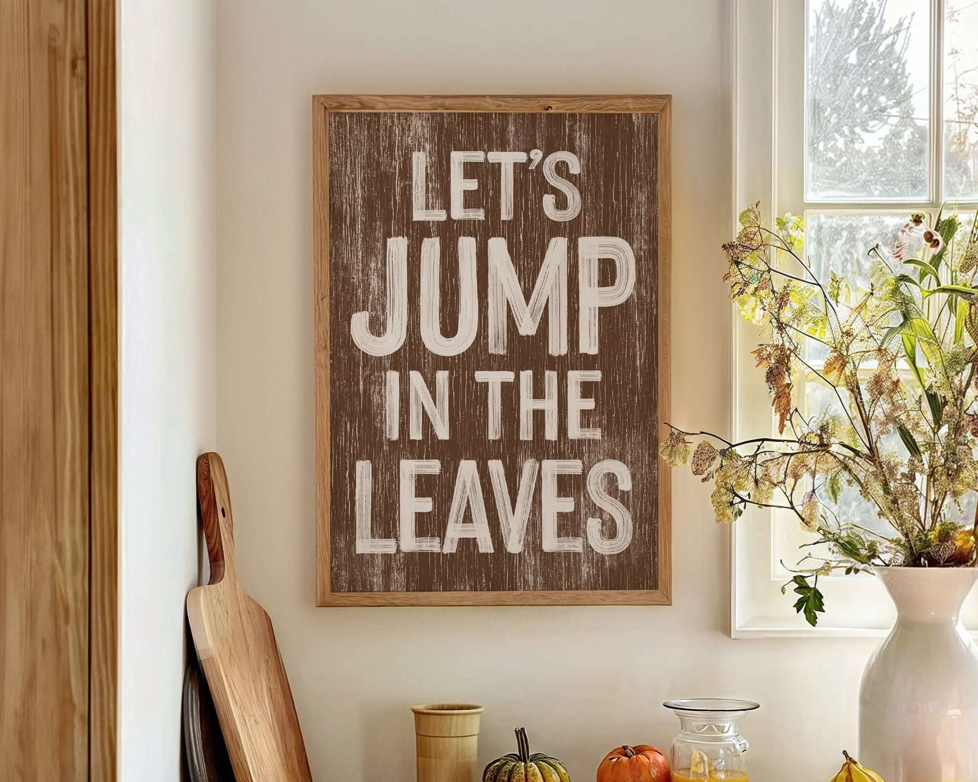 a wooden sign that says let's jump in the leaves