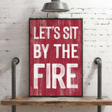 a red sign that says let's sit by the fire