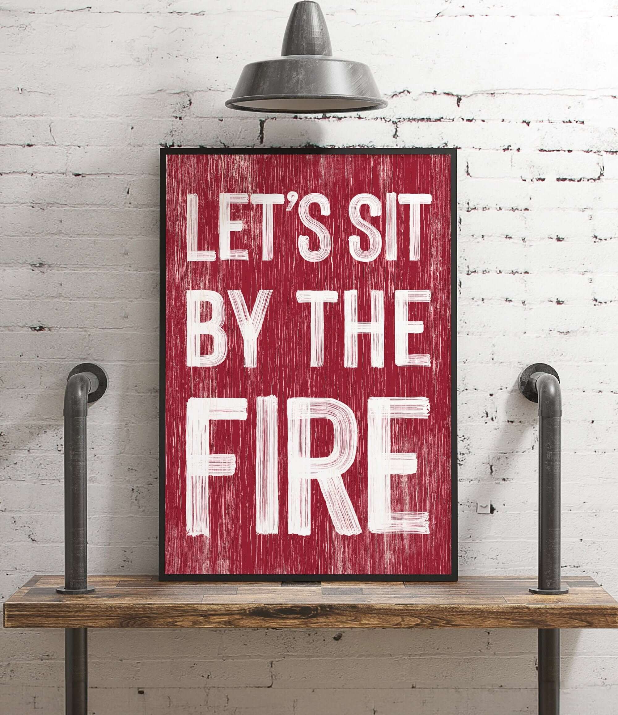 a red sign that says let's sit by the fire