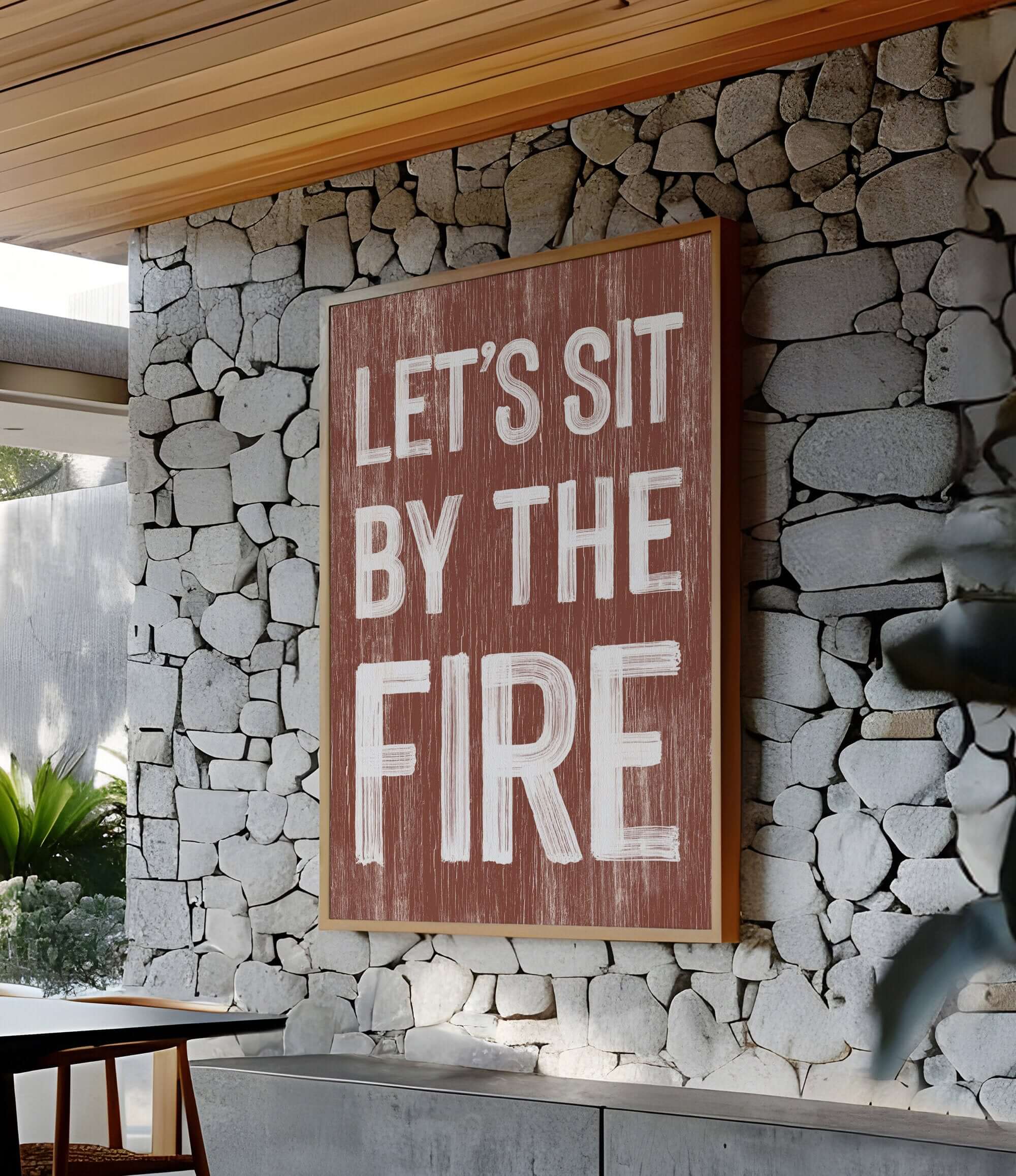 a sign that says let's sit by the fire