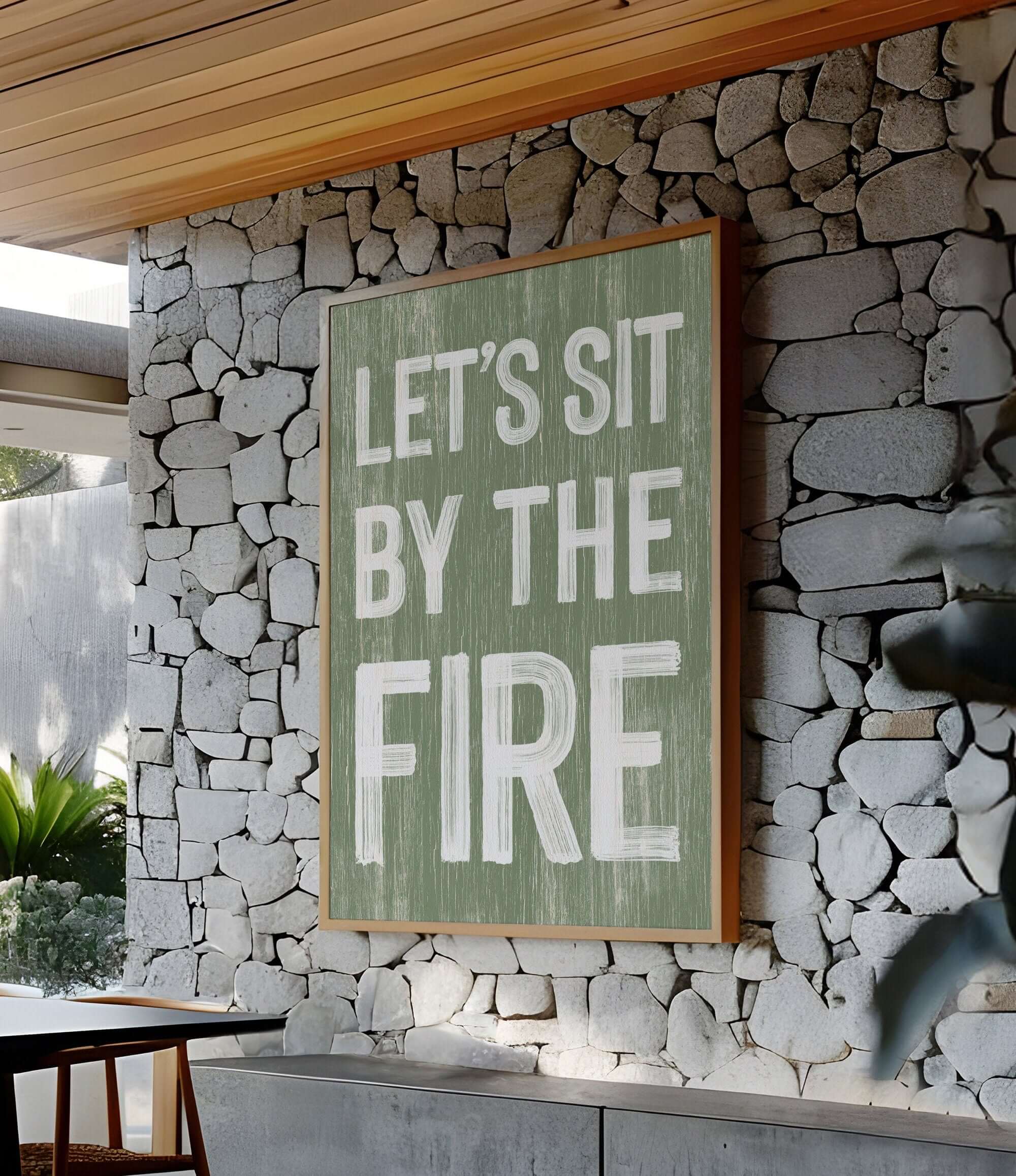 a sign that says let's sit by the fire