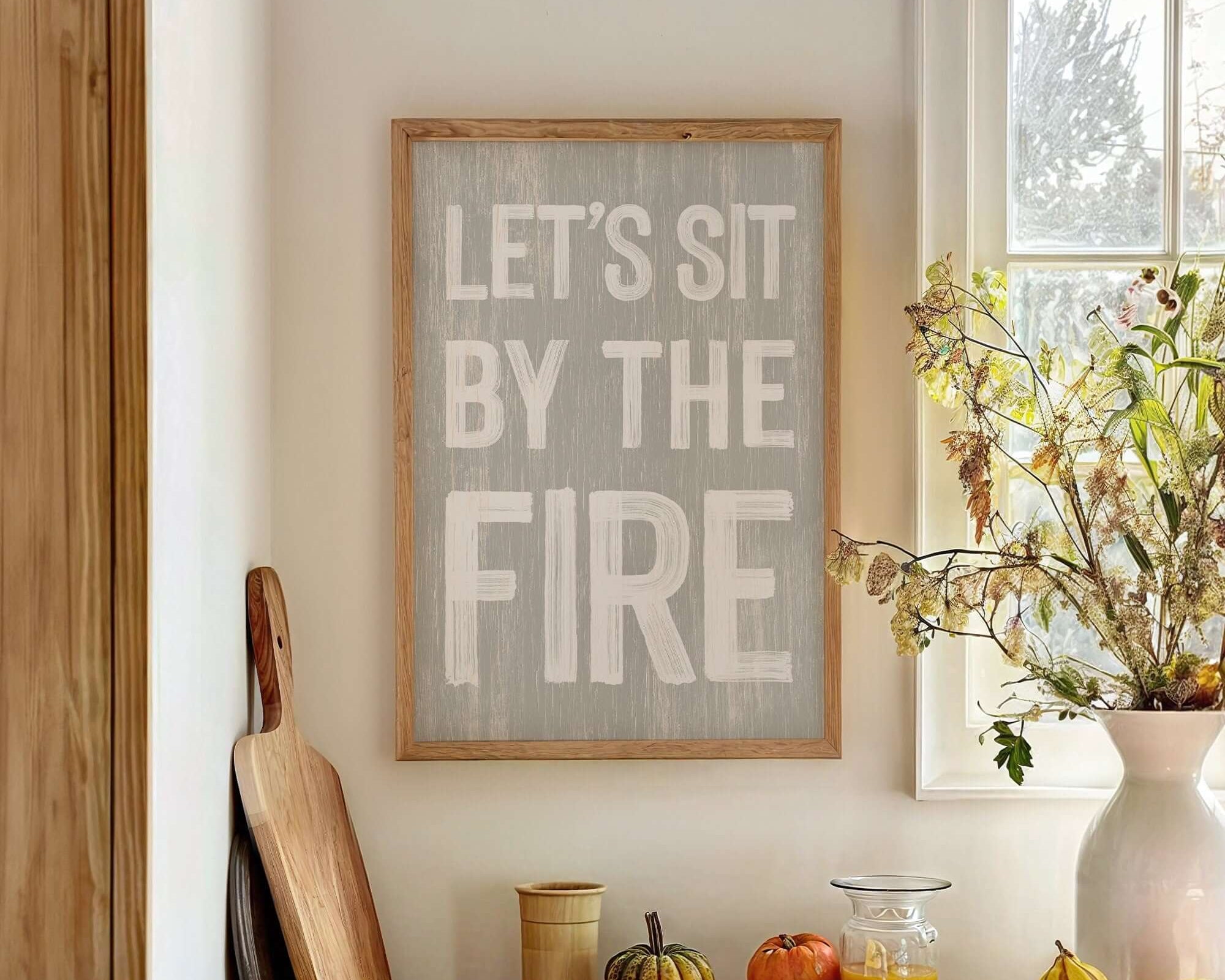 a kitchen counter with a bowl of fruit and a sign that says let's