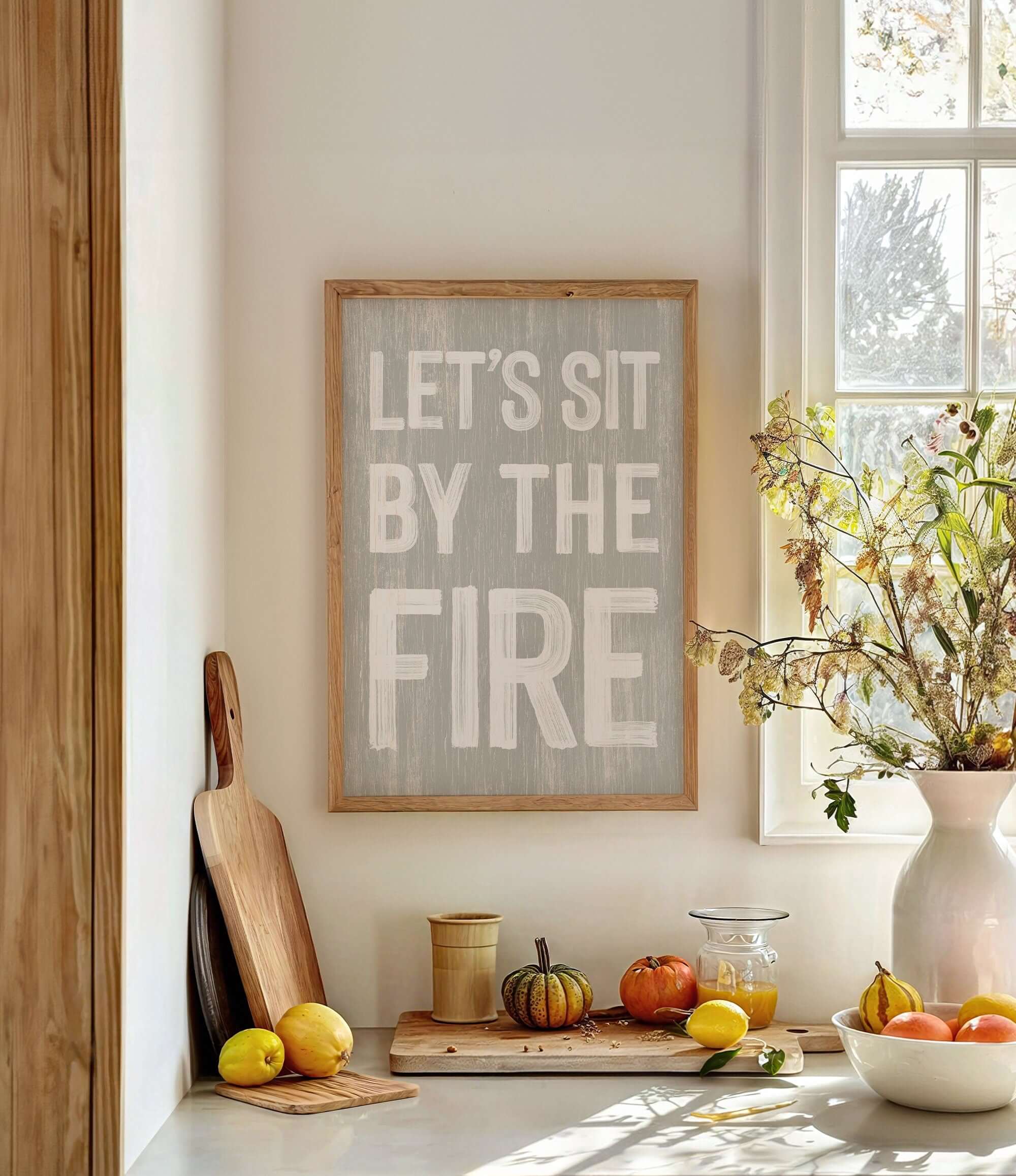 a kitchen counter with a bowl of fruit and a sign that says let's