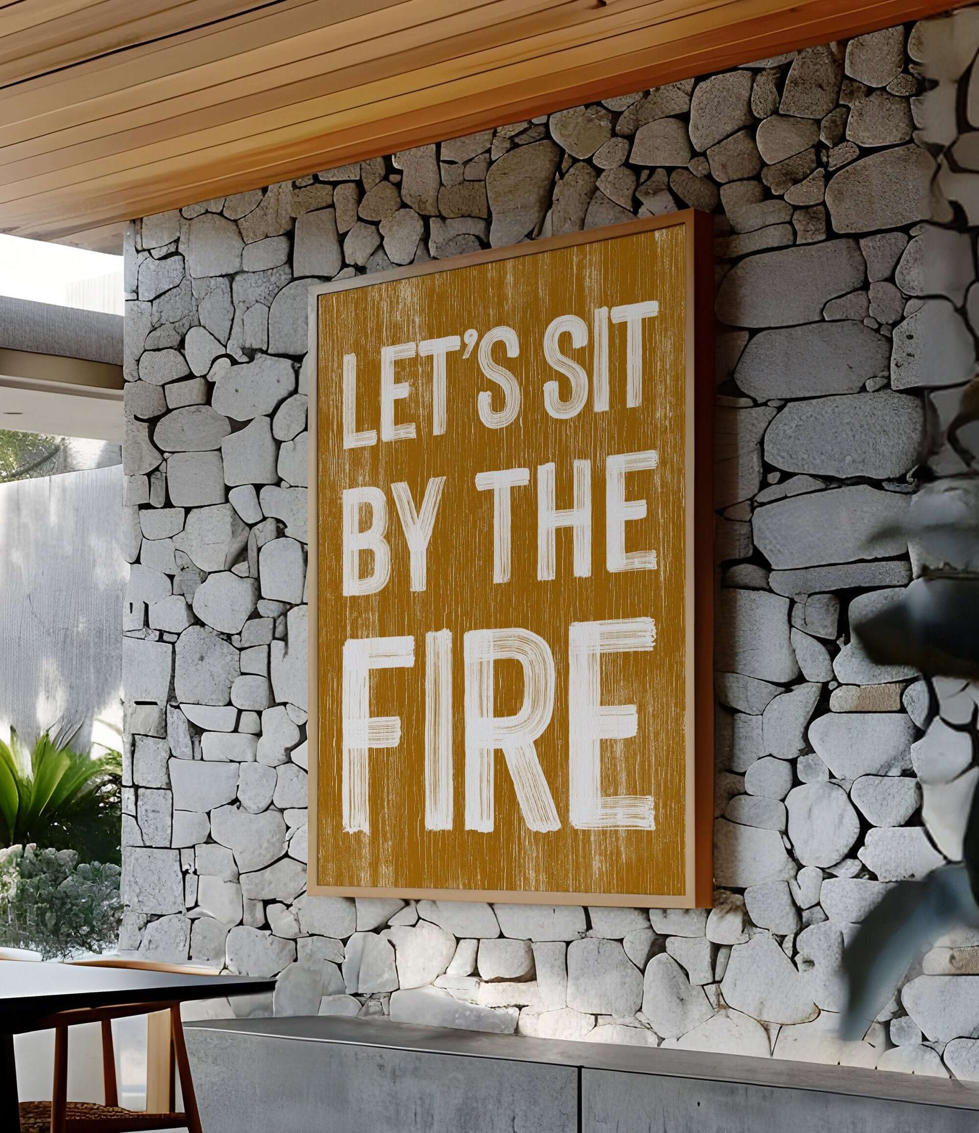 a sign that says let's sit by the fire