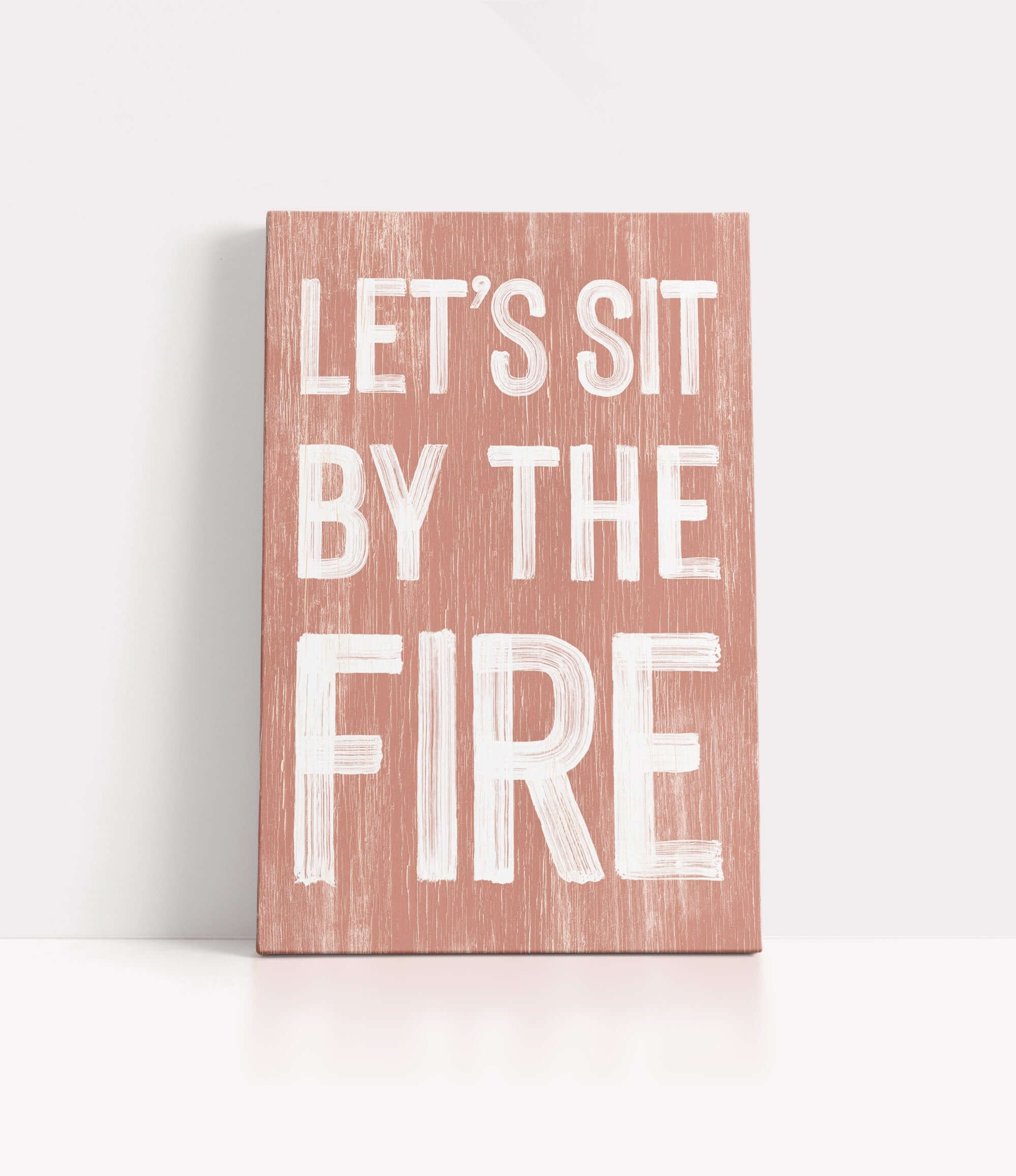 a wooden sign that says let's sit by the fire