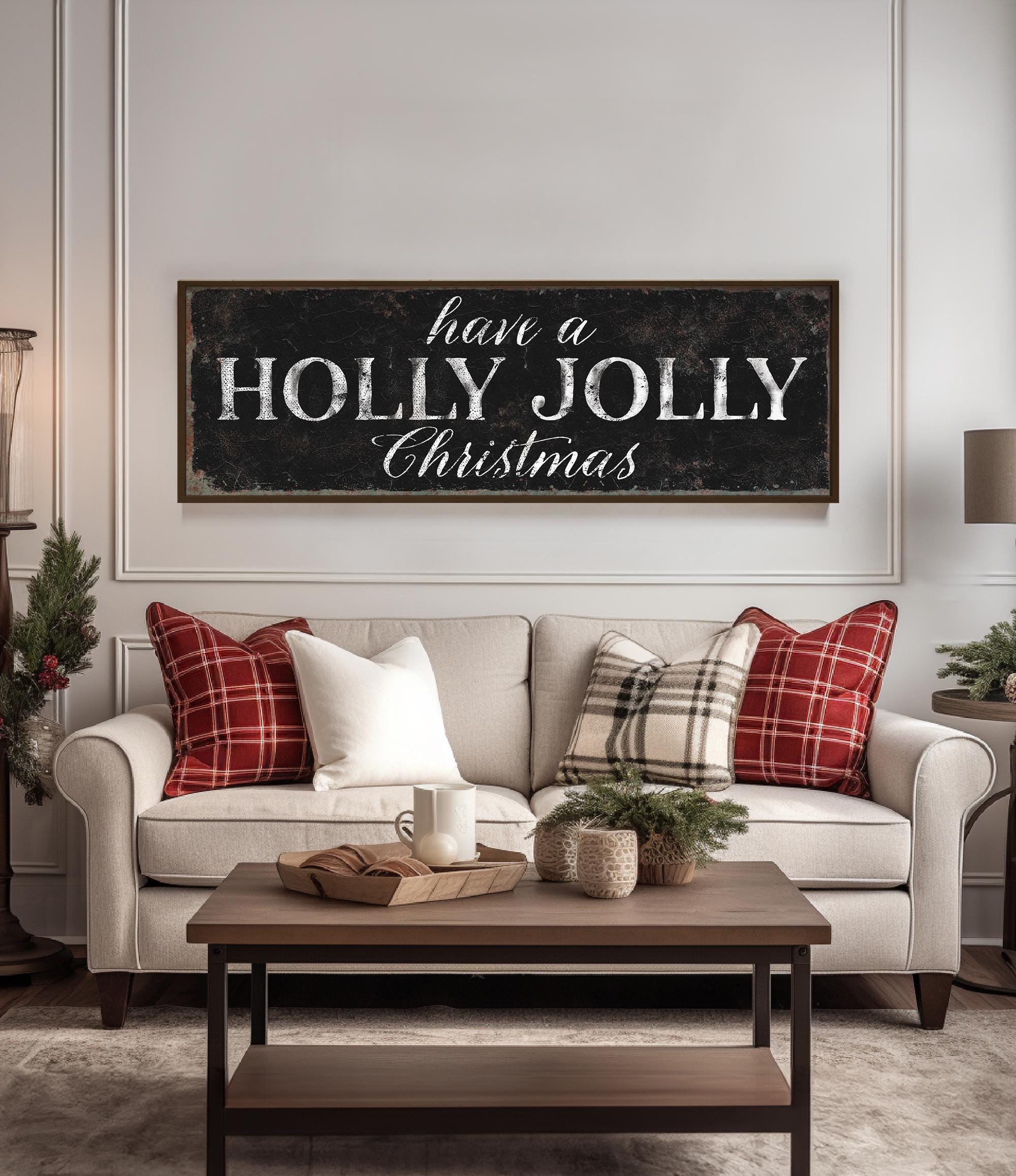 a living room with a christmas sign on the wall