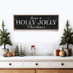 a wooden sign that says have a holly jolly christmas