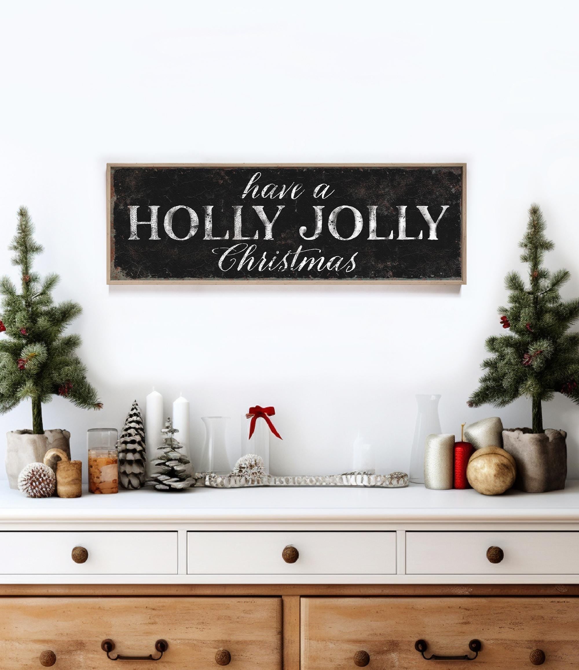 a wooden sign that says have a holly jolly christmas