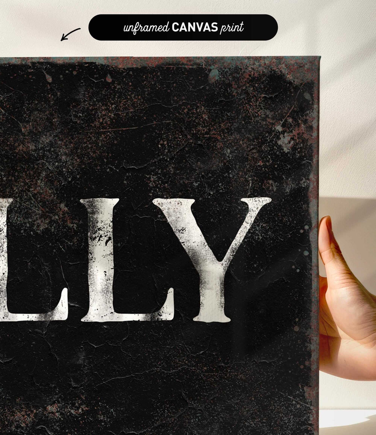 a person holding up a sign that says lily