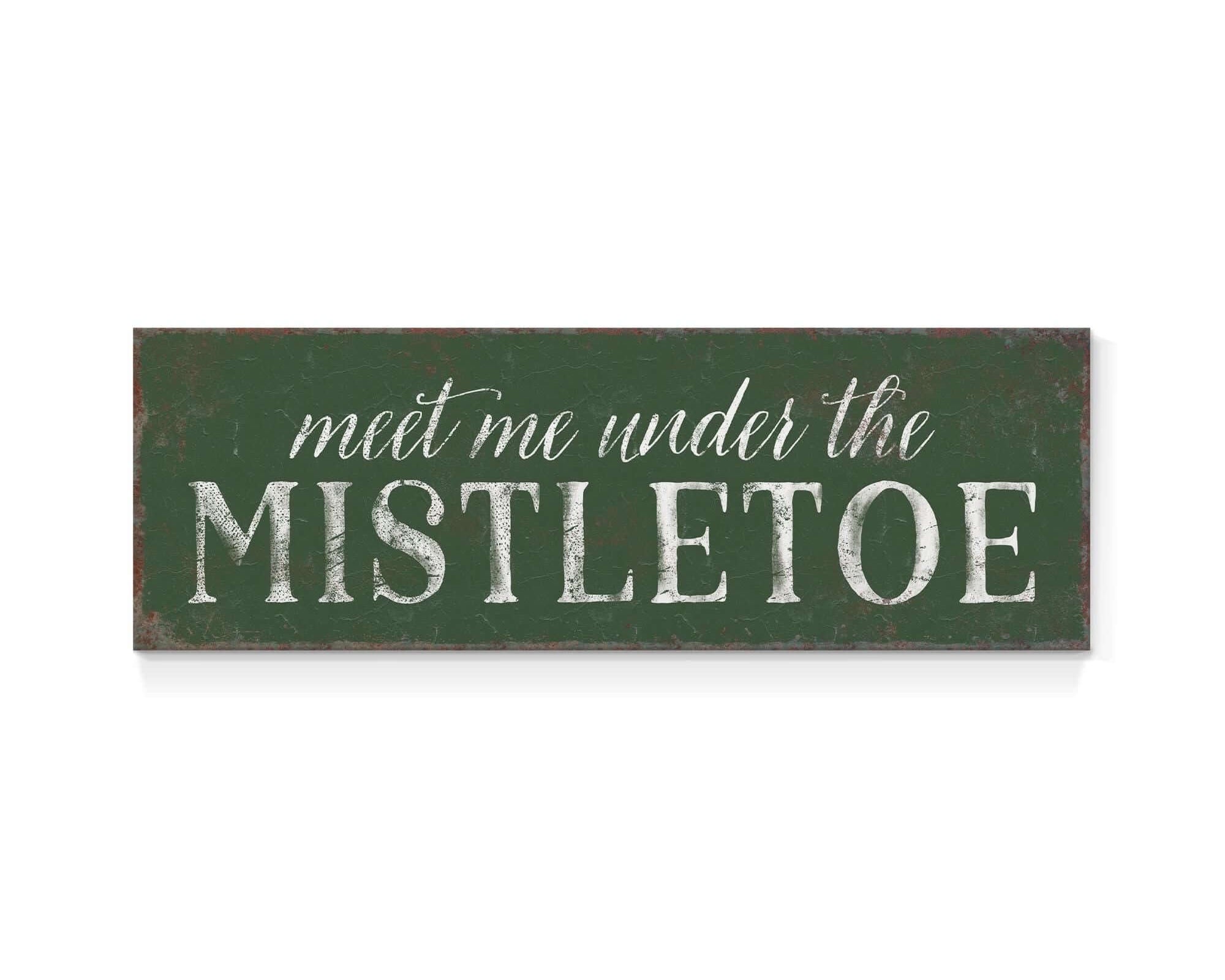 a sign that says meet me under the mistletoe