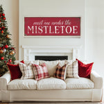 a living room with a white couch and a christmas tree