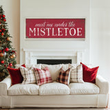 a living room with a white couch and a christmas tree