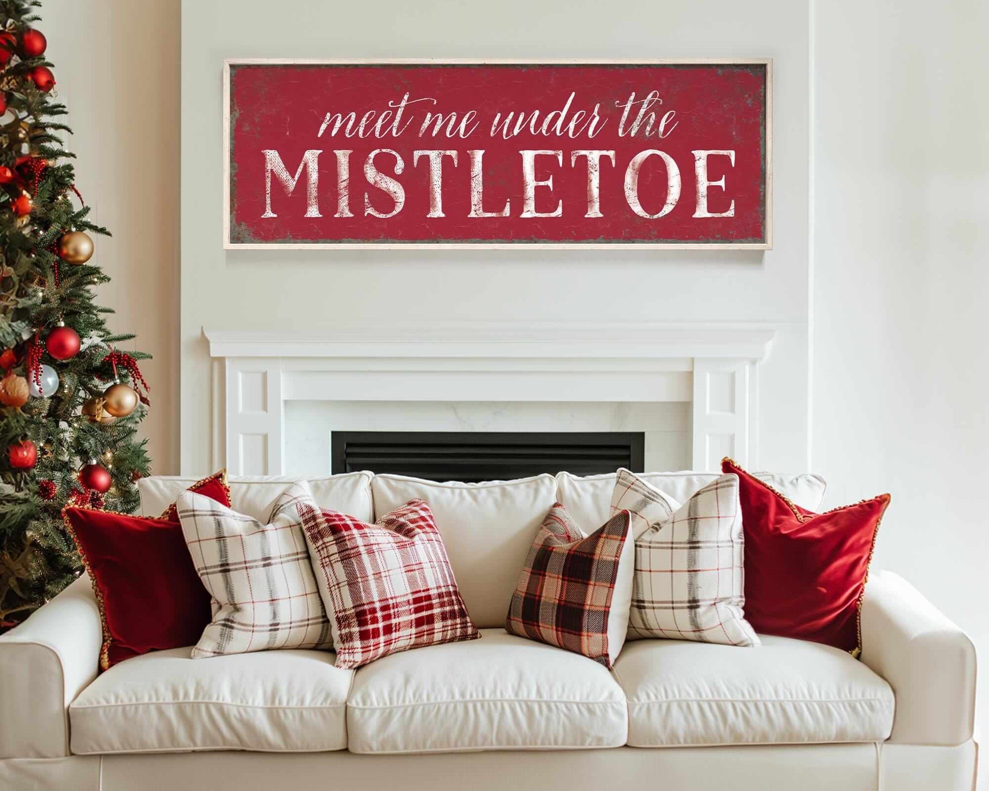 a living room with a white couch and a christmas tree