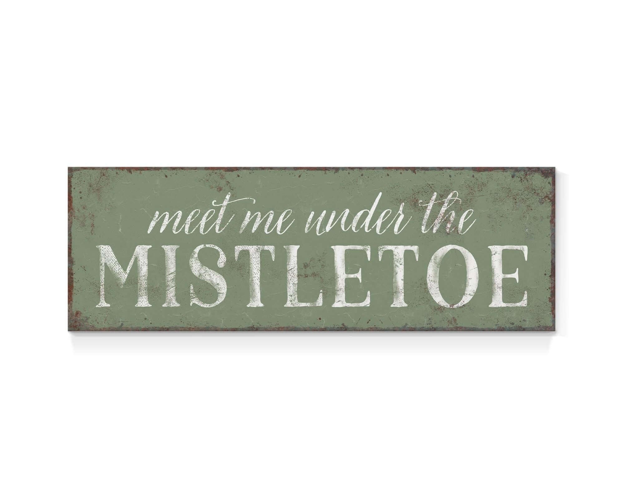 a sign that says meet me under the mistletoe