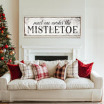 a living room with a white couch and a christmas tree