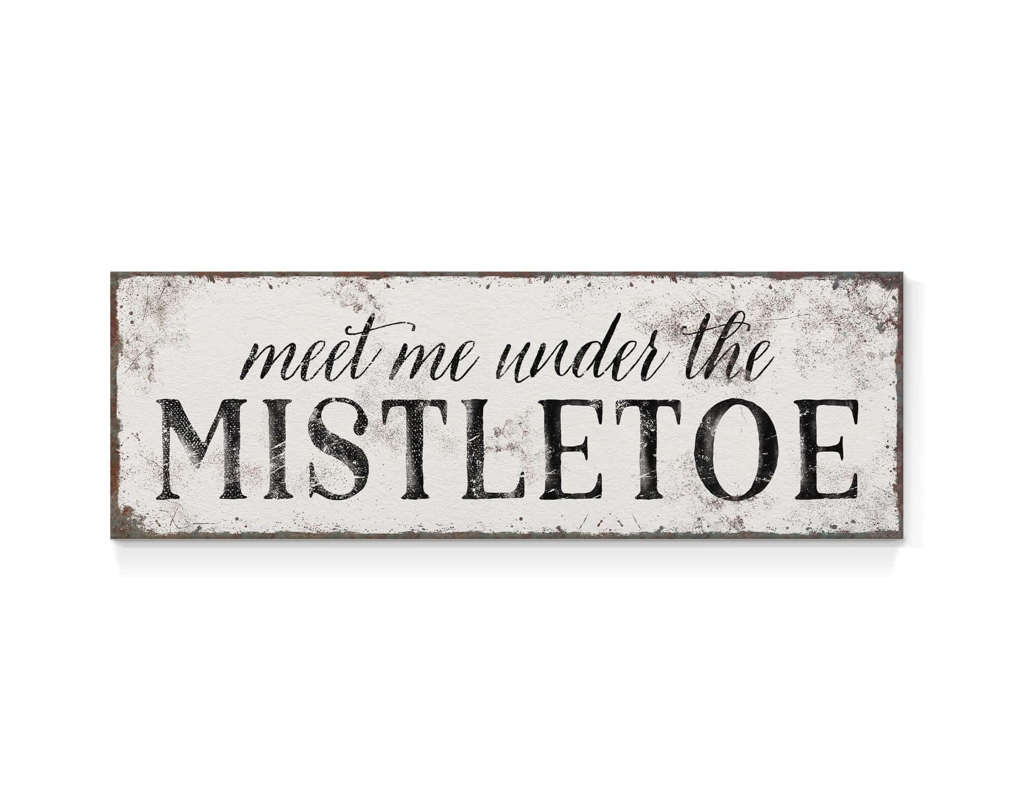 a sign that says meet me under the mistletoe