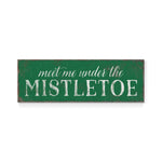 a green sign that says meet me under the mistletoe